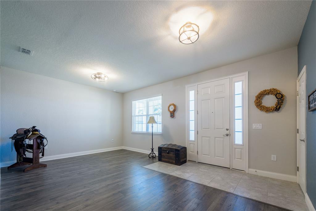4444 Devinshire Fields Loop Plant City, FL 33567 - Photo 6 of 38 an empty room with windows and closet