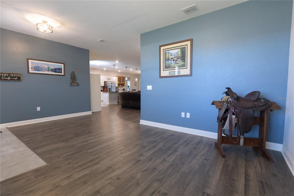 4444 Devinshire Fields Loop Plant City, FL 33567 - Photo 7 of 38 a view of a livingroom with furniture and a workspace