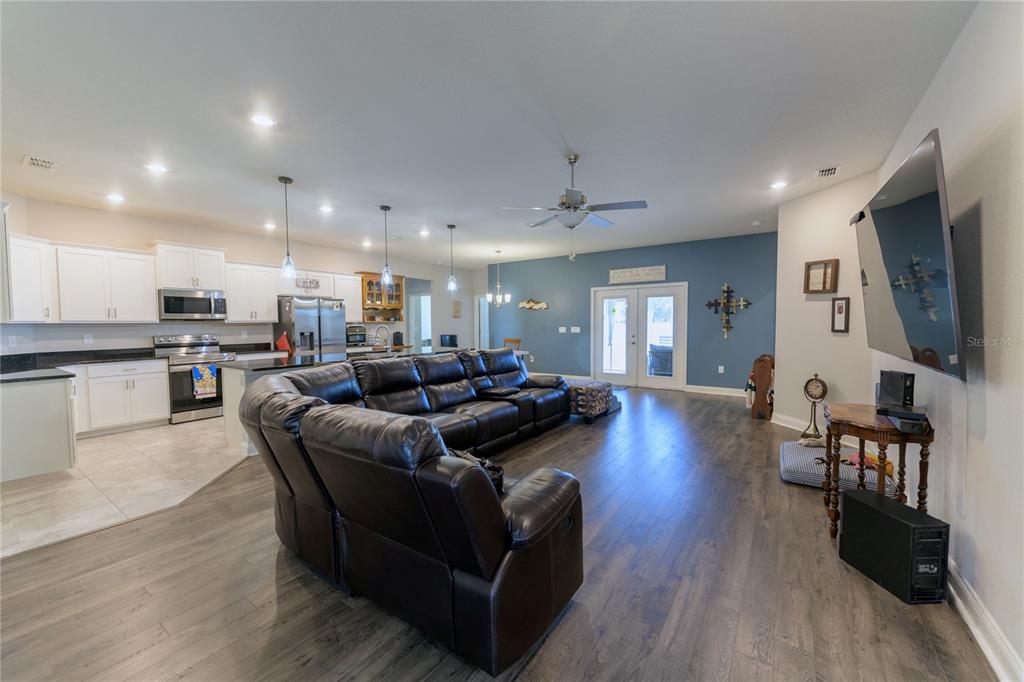 4444 Devinshire Fields Loop Plant City, FL 33567 - Photo 8 of 38 a living room with furniture and a flat screen tv