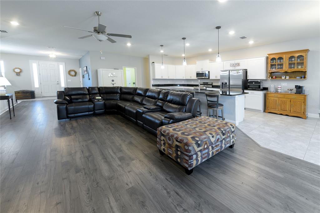 4444 Devinshire Fields Loop Plant City, FL 33567 - Photo 9 of 38 a living room with furniture and kitchen view