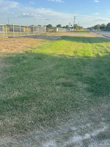 a view of a large body of water with a building in the background