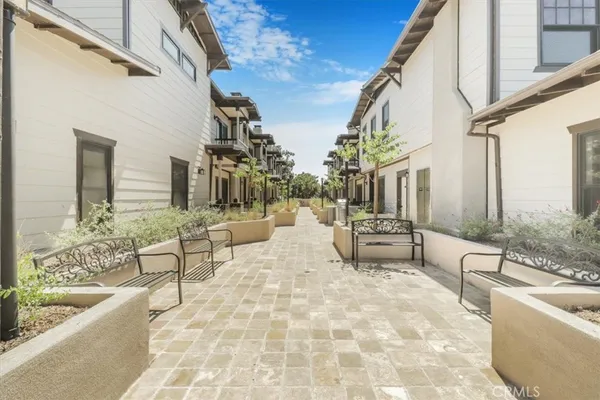 a front view of a house with plants