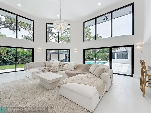 a bedroom with a large bed and a large window