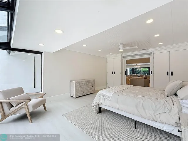 a room with a large window and a sink