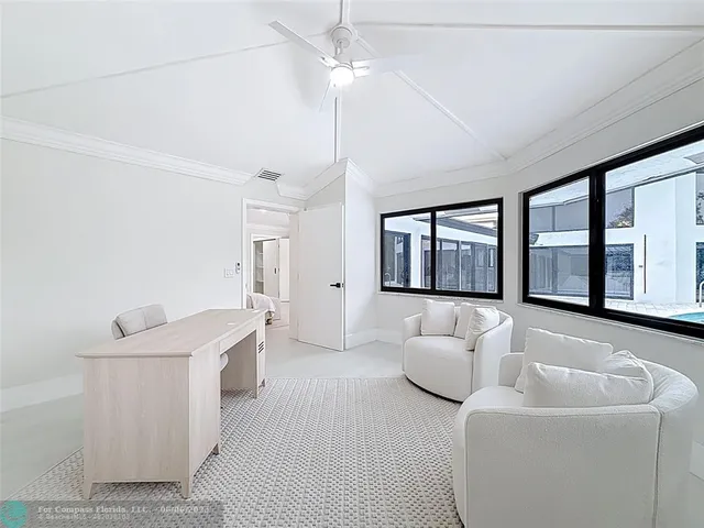 a spacious bathroom with double sink and a large mirror