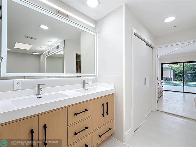 a view of backyard with deck and garden