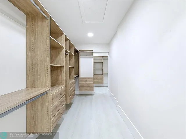 a front view of a house with fountain and porch