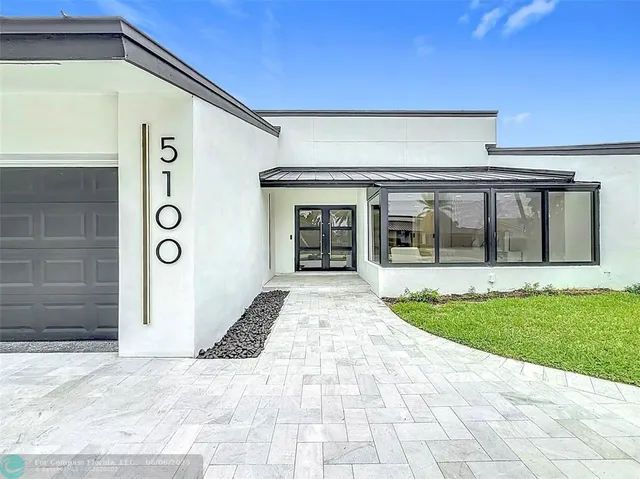 a lobby with furniture and window