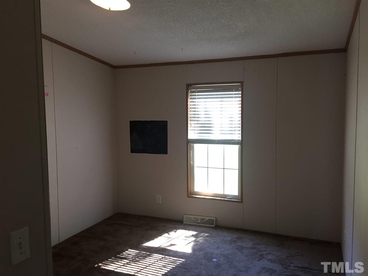 16 Trevor Kirk Road Timberlake, NC 27583 - Photo 8 of 12 an empty room with a window