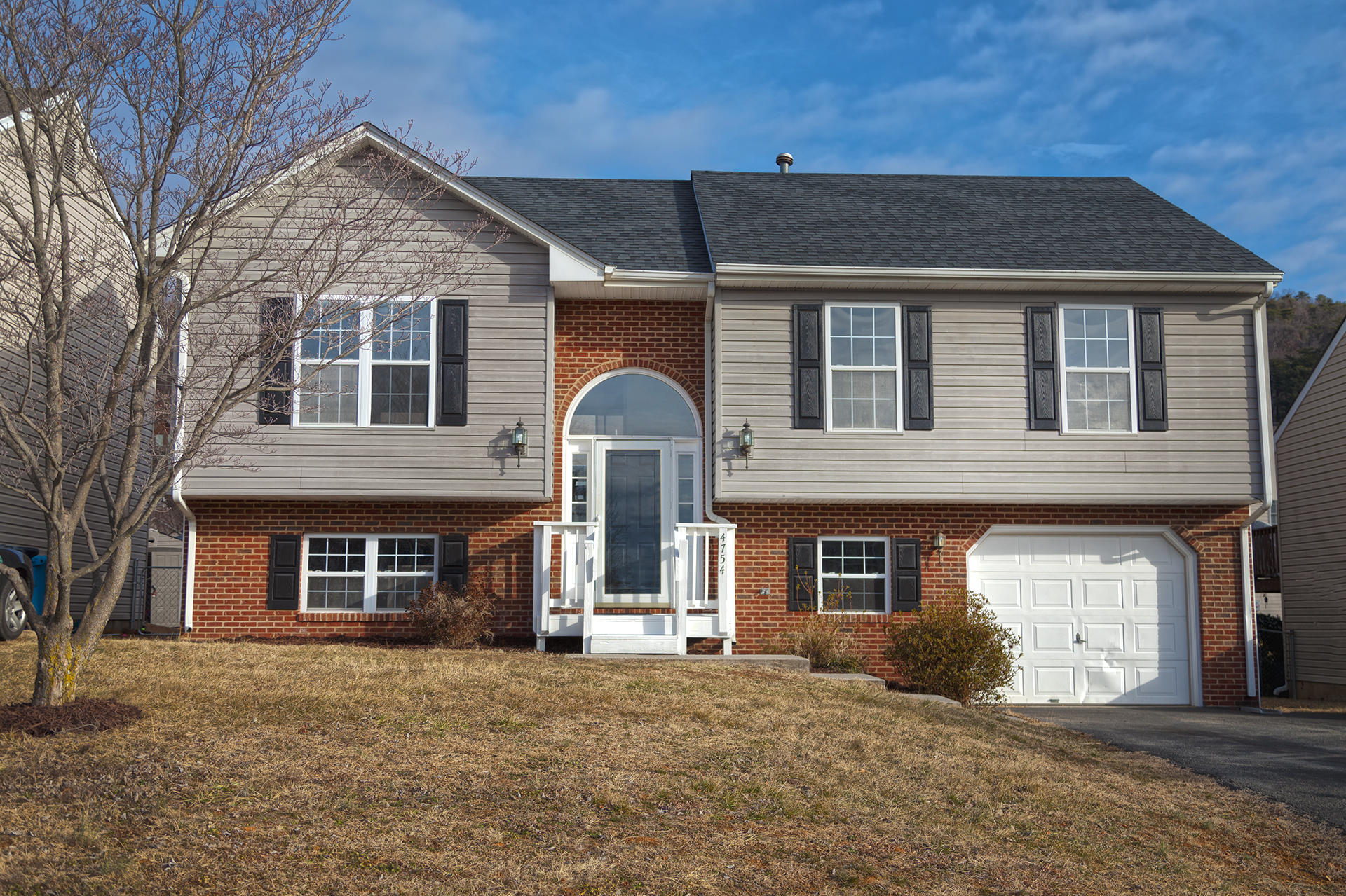 a front view of a house with a yard