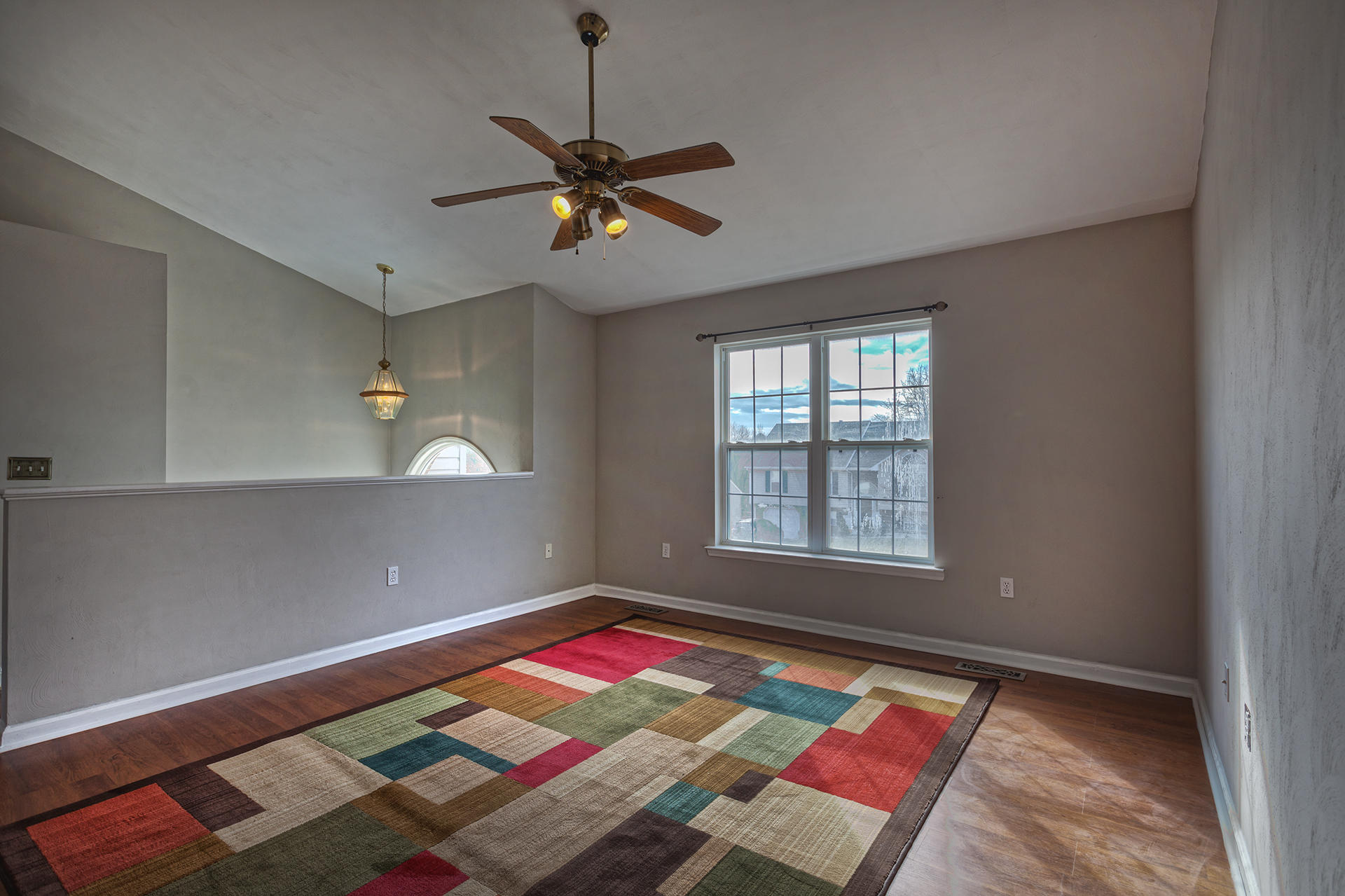 4754 West Westvale Road Northeast Roanoke, VA 24019 - Photo 2 of 22 a bed sitting in a room next to a window