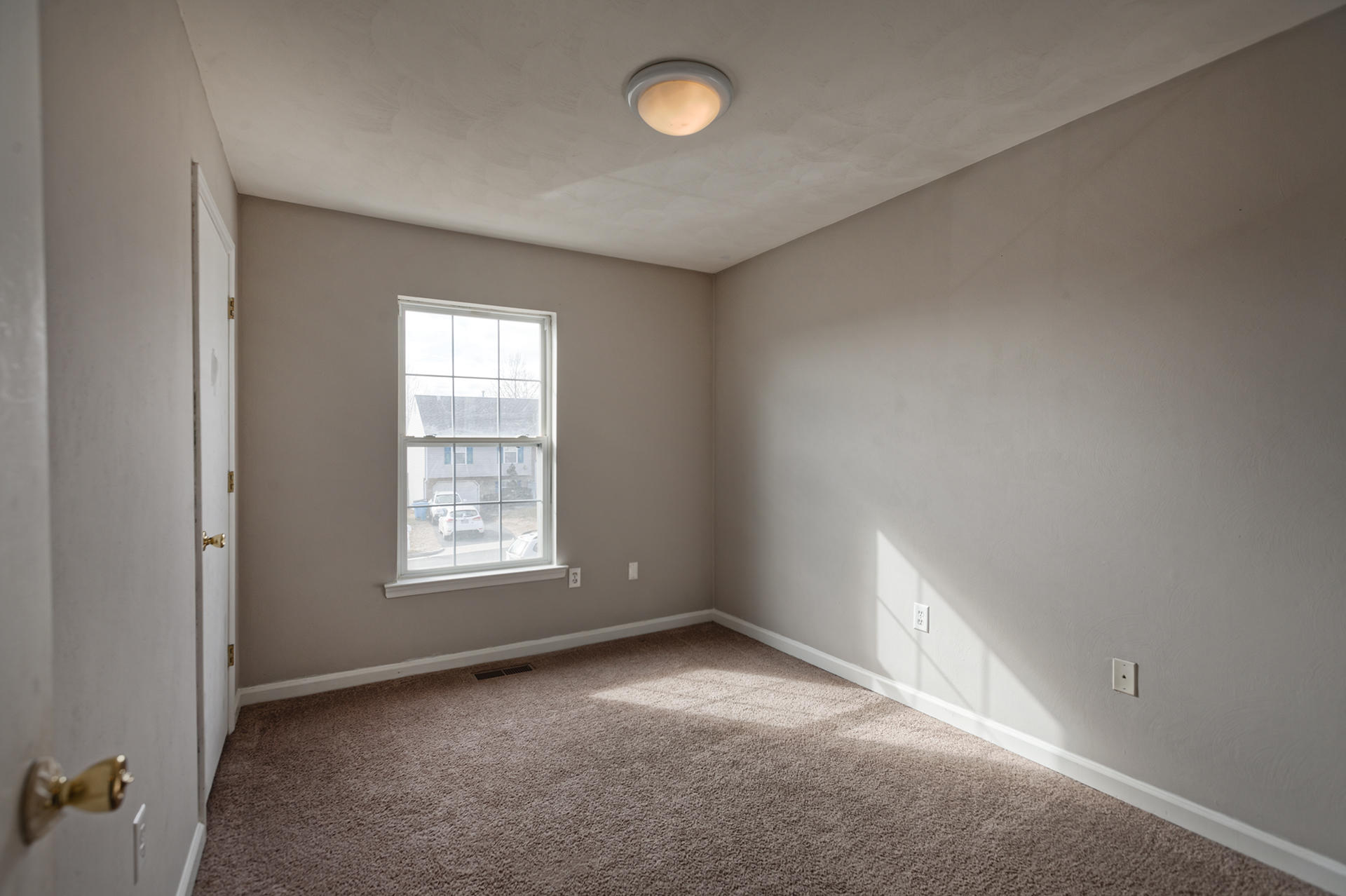 4754 West Westvale Road Northeast Roanoke, VA 24019 - Photo 12 of 22 an empty room with windows