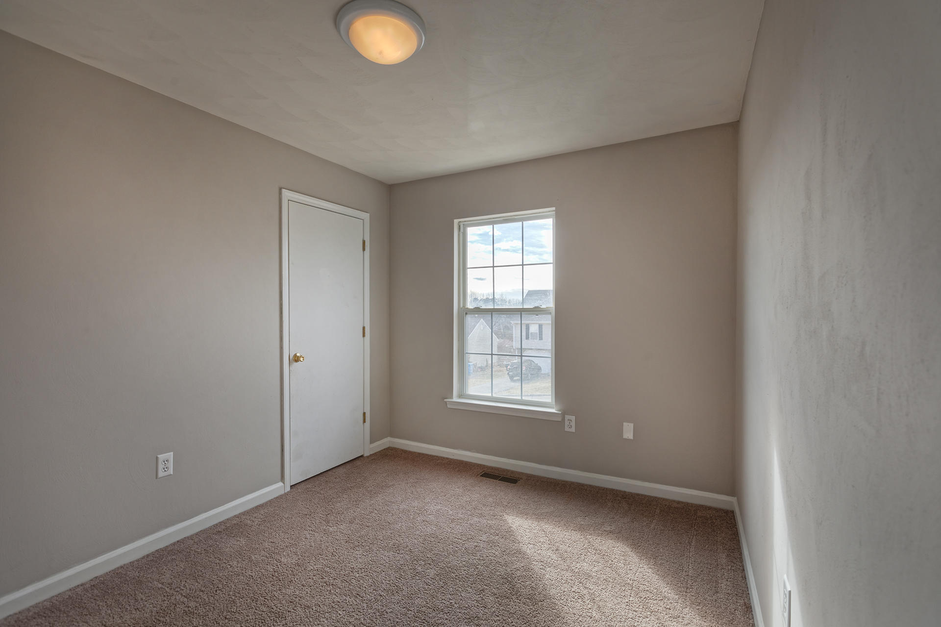 4754 West Westvale Road Northeast Roanoke, VA 24019 - Photo 13 of 22 an empty room with windows and closet