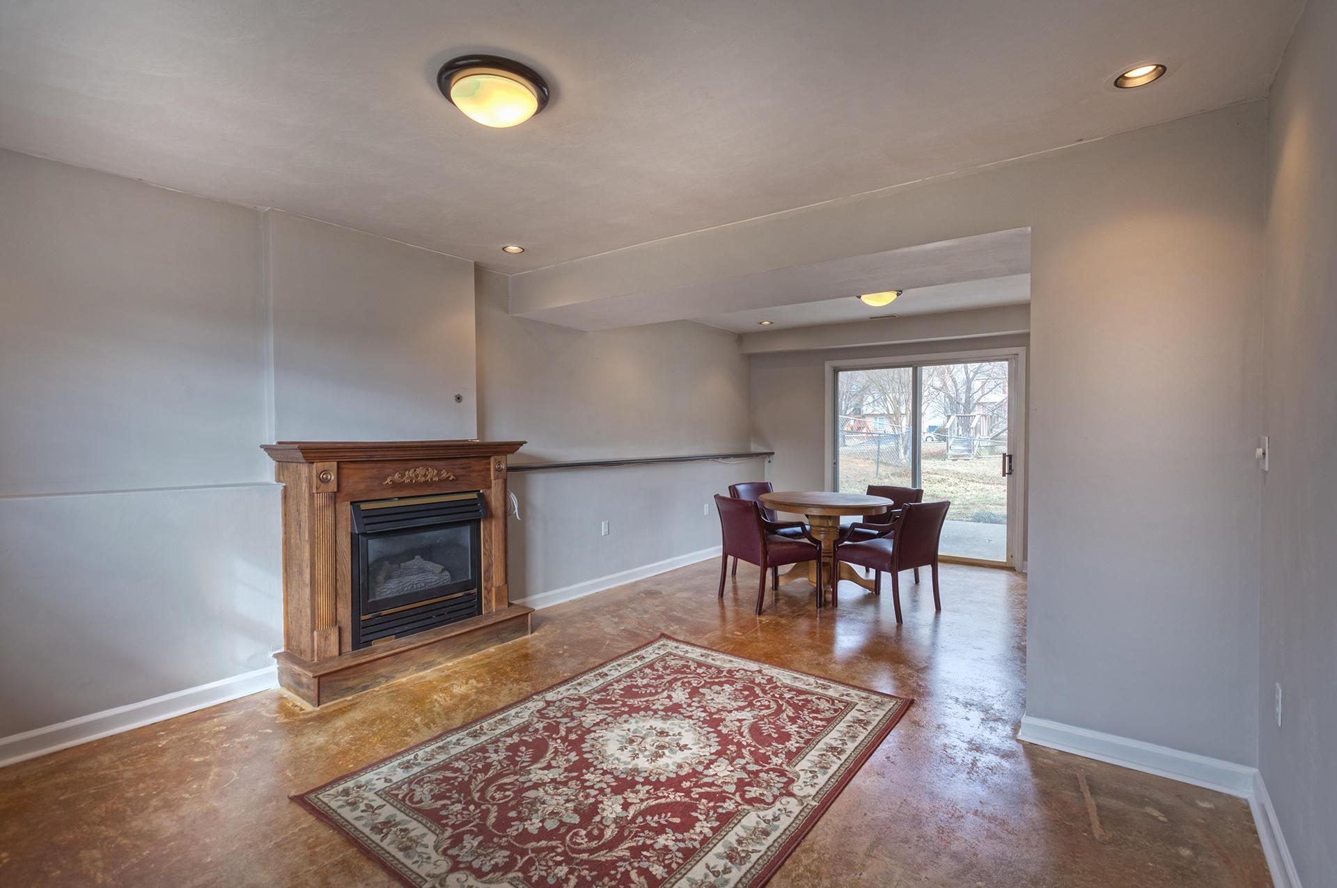 4754 West Westvale Road Northeast Roanoke, VA 24019 - Photo 14 of 22 a living room with furniture and a fireplace