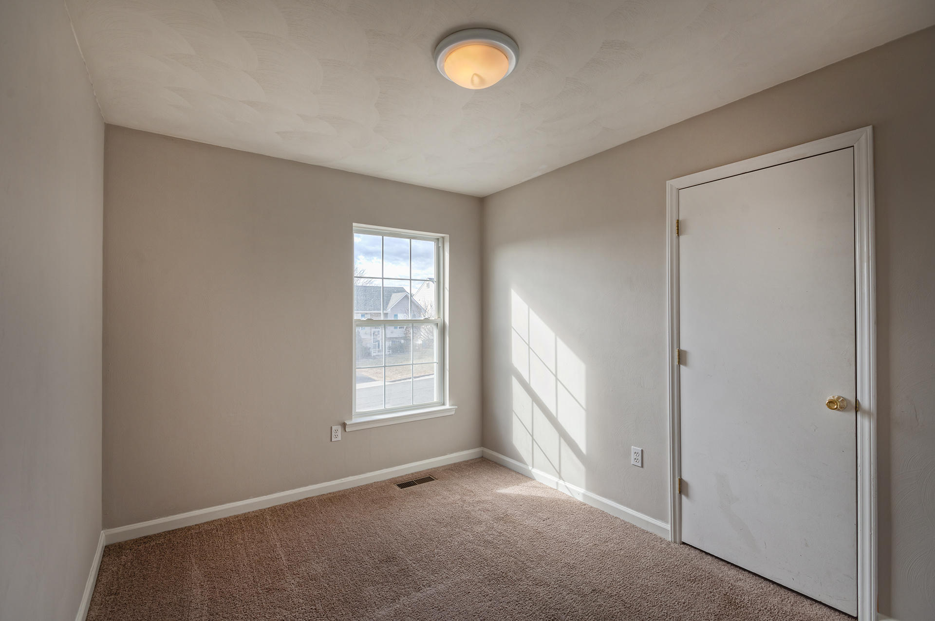 4754 West Westvale Road Northeast Roanoke, VA 24019 - Photo 9 of 22 an empty room with windows and closet