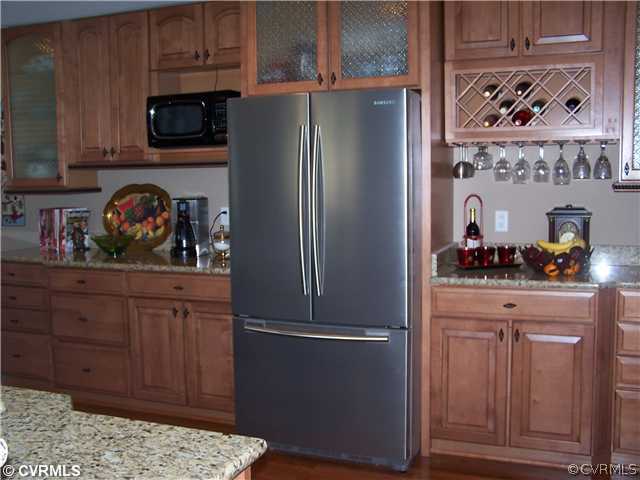 14801 River Road Chesterfield, VA 23838 - Photo 3 of 12 a kitchen with stainless steel appliances granite countertop a refrigerator and a stove