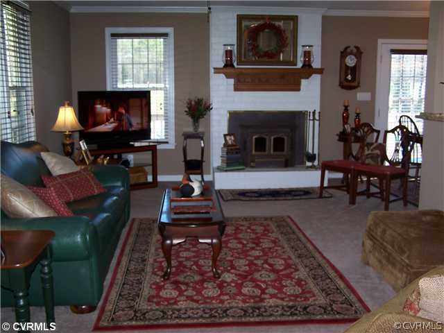 14801 River Road Chesterfield, VA 23838 - Photo 5 of 12 a living room with furniture a rug and a flat screen tv