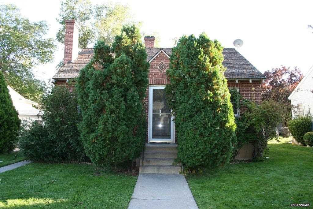 236-238 Caliente Street Reno, NV 89509 - Photo 1 of 1 a view of house with garden and tall trees