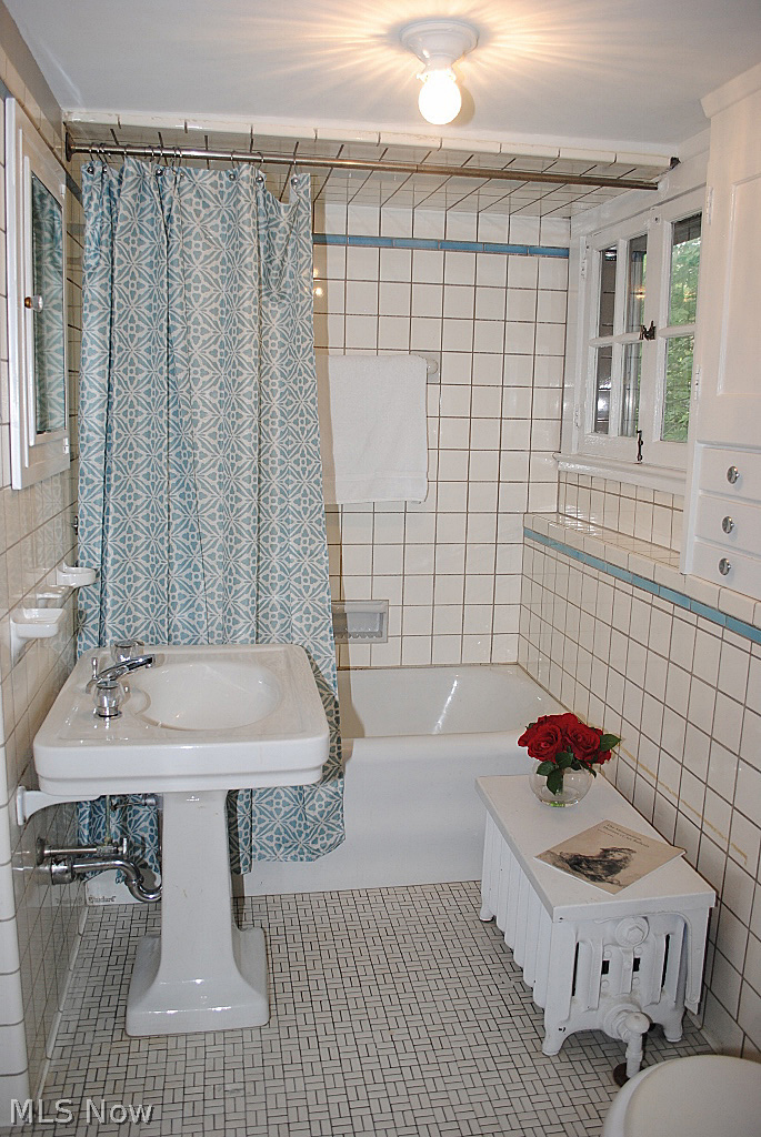 14305 Drexmore Road Cleveland, OH 44120 - Photo 16 of 25 CHARMING MASTER BATH WITH ORIGINAL TILE, PEDESTAL SINK AND LOTS OF STORAGE