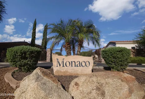 a view of outdoor space with sign board and lake view