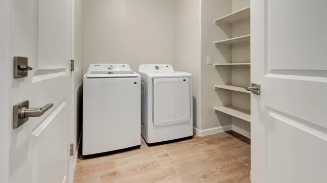 a utility room with dryer and washer
