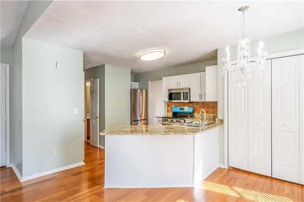 a view of a kitchen from a dining room