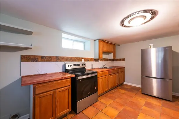 a bathroom with a bathtub sink and mirror