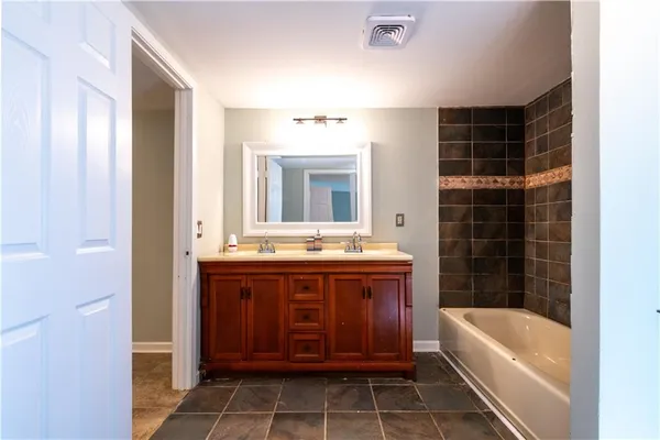a kitchen with a sink cabinets and window