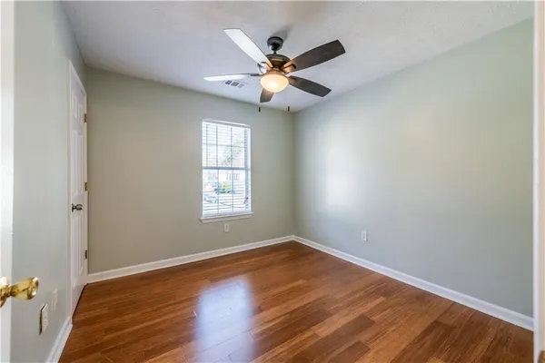 a view of room with wooden floor