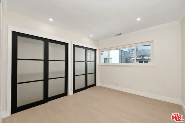 a view of empty room with windows