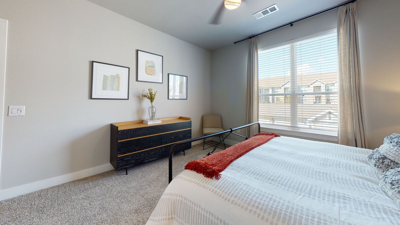 24002 Colonial Parkway, Unit 4215 Katy, TX 77493 - Photo 14 of 31 a bedroom with a bed and a window