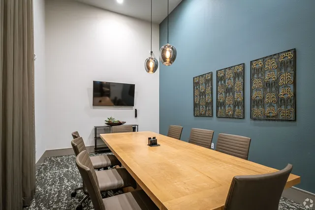 a room with furniture and a flat screen tv