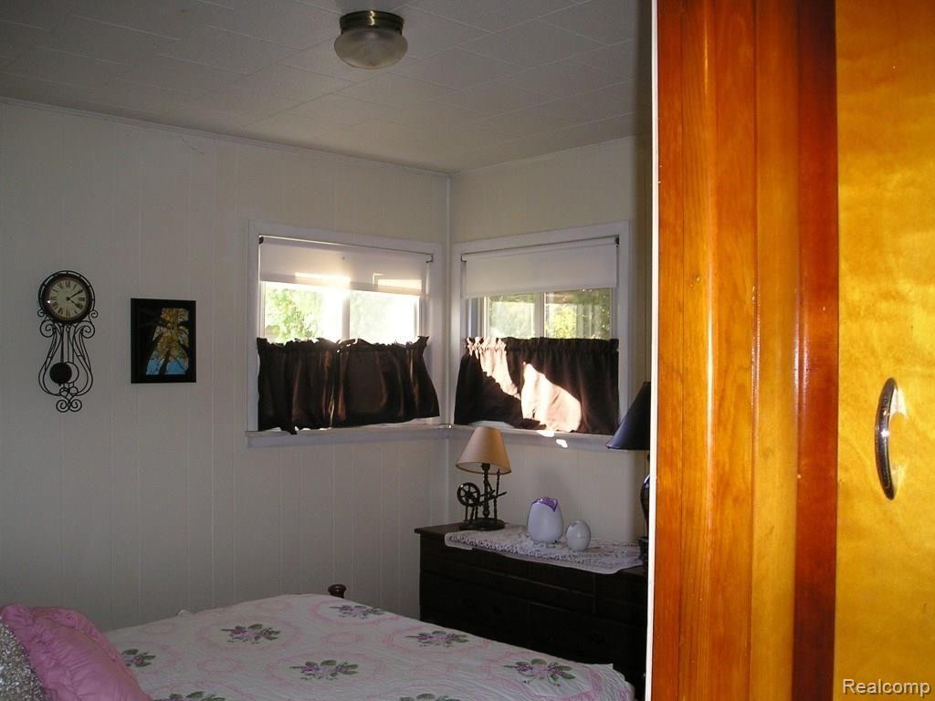 130 West Capac Road Imlay City, MI 48444 - Photo 13 of 20 Quest bedroom with hardwood floor.