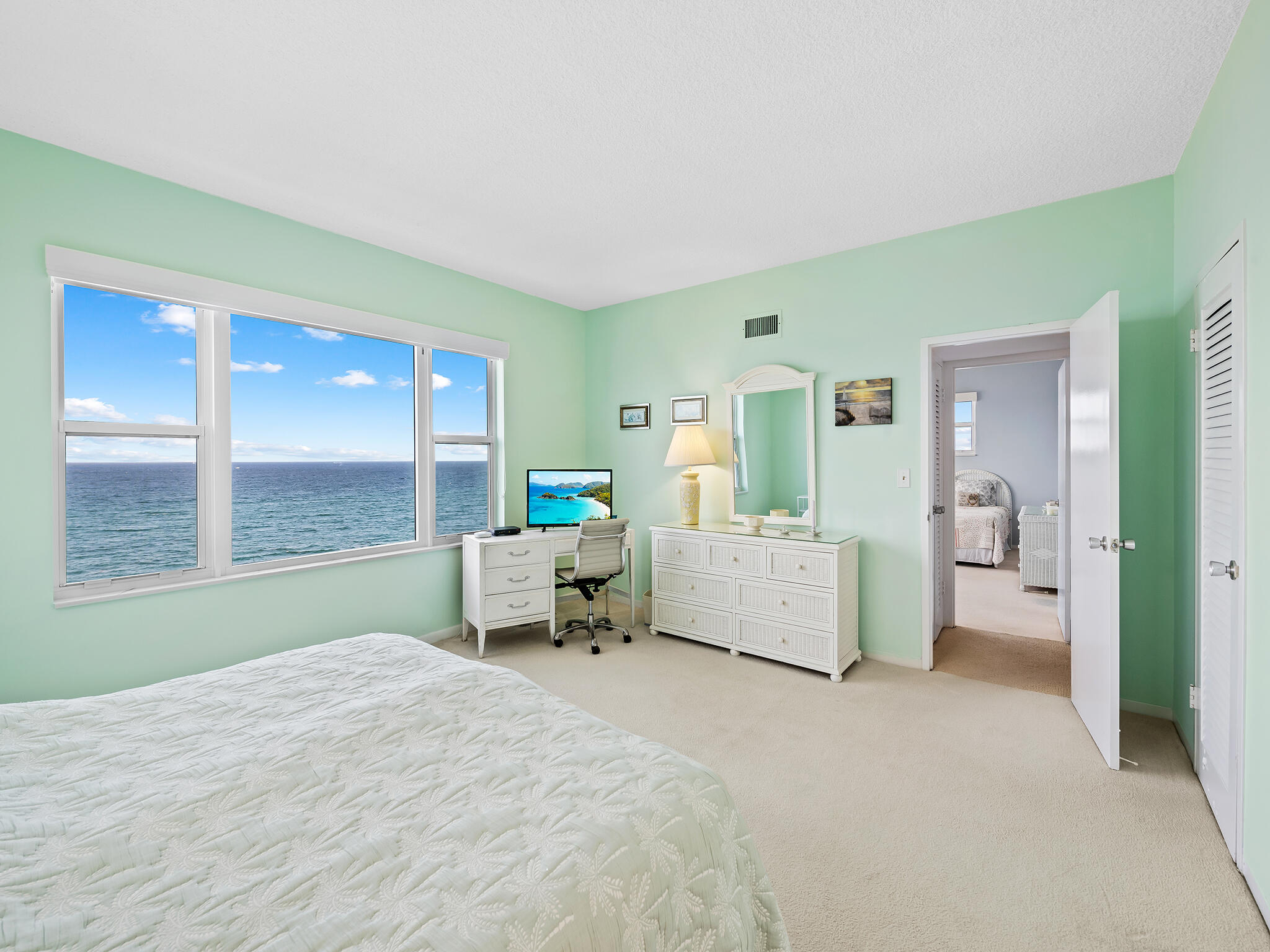 2921 South Ocean Boulevard, Unit 507 Highland Beach, FL 33487 - Photo 14 of 22 a spacious bedroom with a bed and a large window