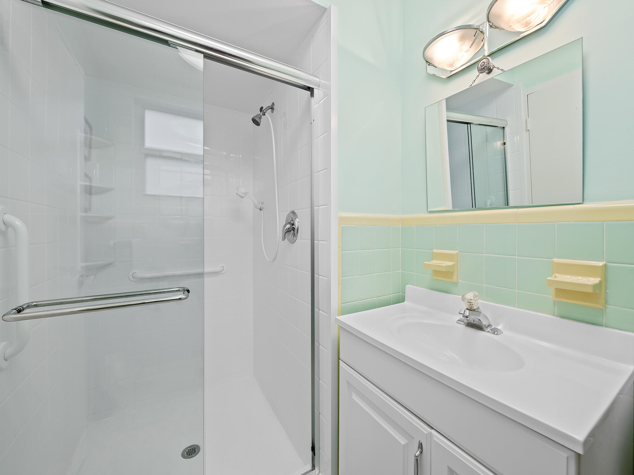 2921 South Ocean Boulevard, Unit 507 Highland Beach, FL 33487 - Photo 15 of 22 a bathroom with a sink and a mirror