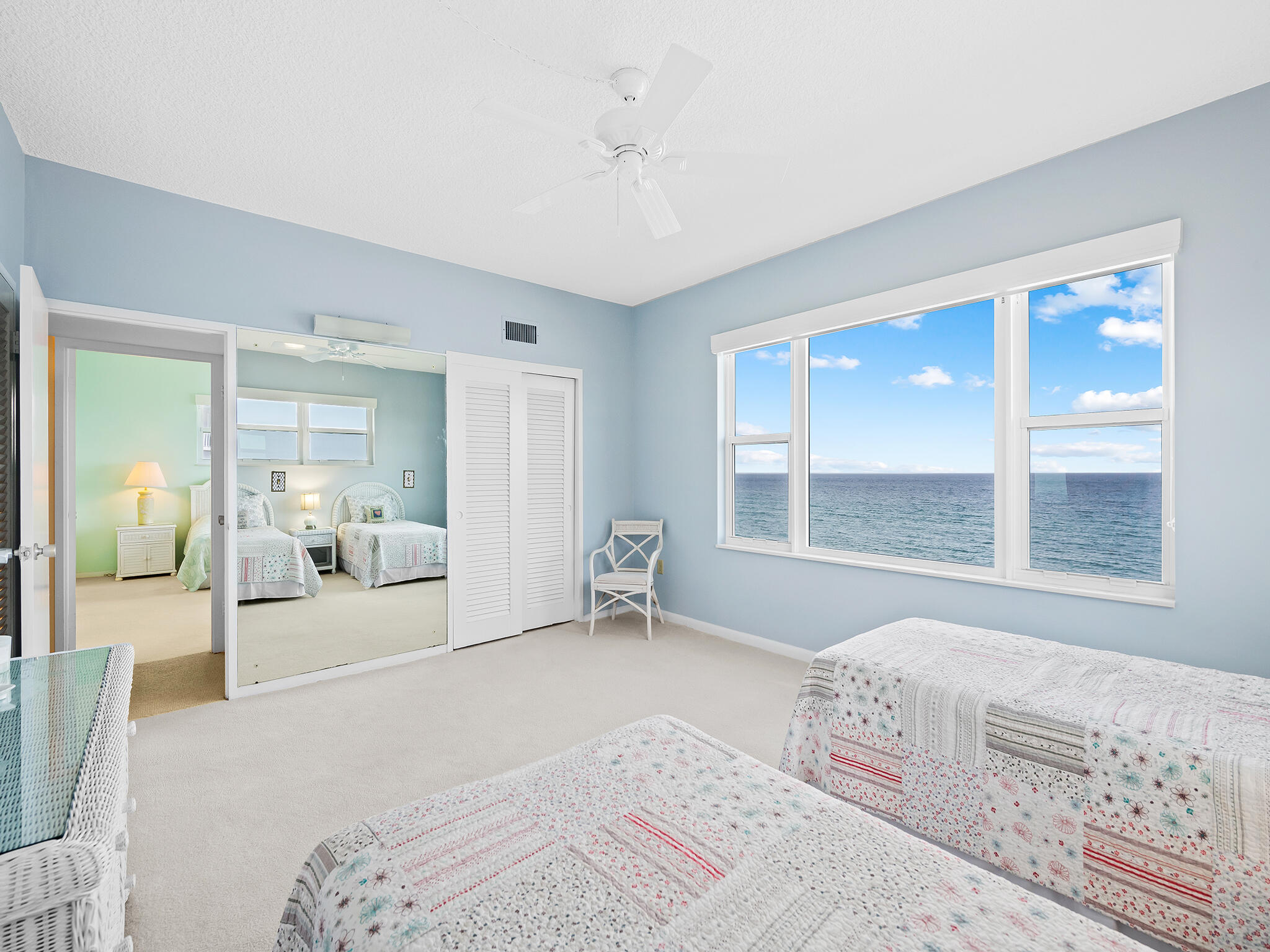 2921 South Ocean Boulevard, Unit 507 Highland Beach, FL 33487 - Photo 18 of 22 a bedroom with a large bed and a large window