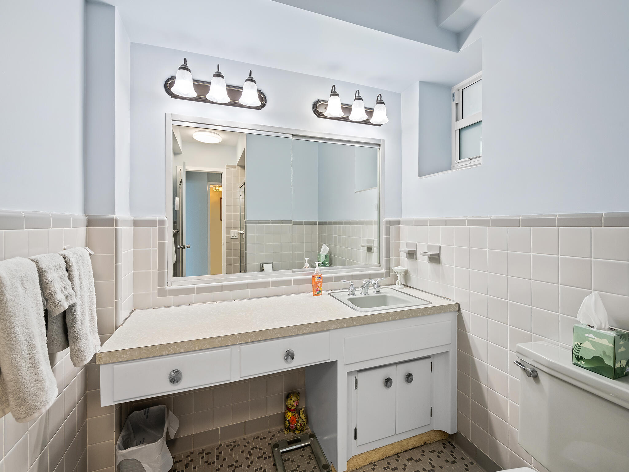 2921 South Ocean Boulevard, Unit 507 Highland Beach, FL 33487 - Photo 20 of 22 a bathroom with a sink and a mirror