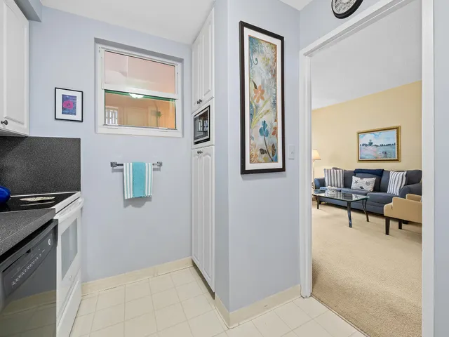 a view of kitchen with furniture and a window