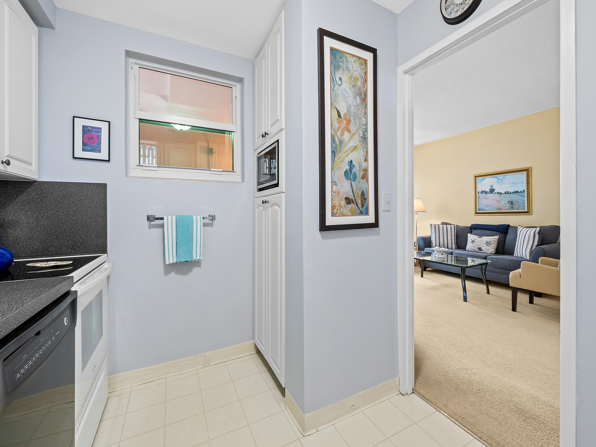 2921 South Ocean Boulevard, Unit 507 Highland Beach, FL 33487 - Photo 10 of 22 a view of kitchen with furniture and a window