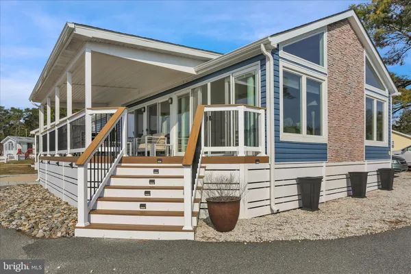 a view of a house with wooden floor and fence