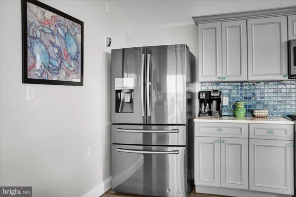 a kitchen with cabinets and stainless steel appliances