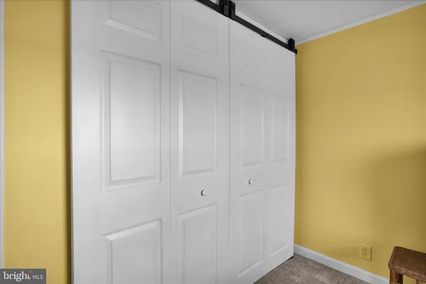 a bedroom with a bed and a table in it