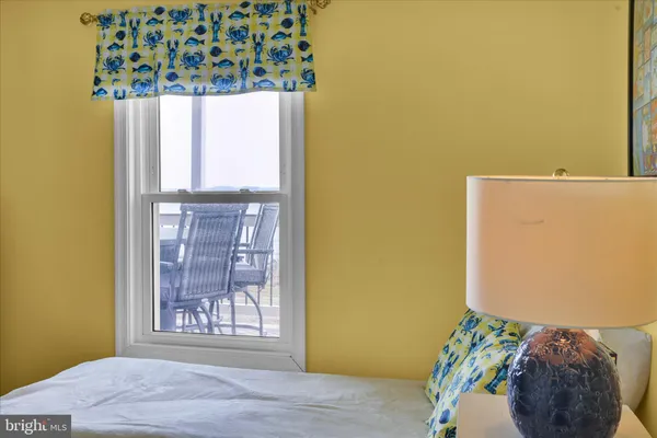 a view of a patio with table and chairs and wooden floor