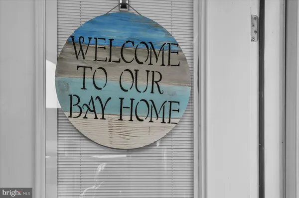 a view of a wooden bench under a roof