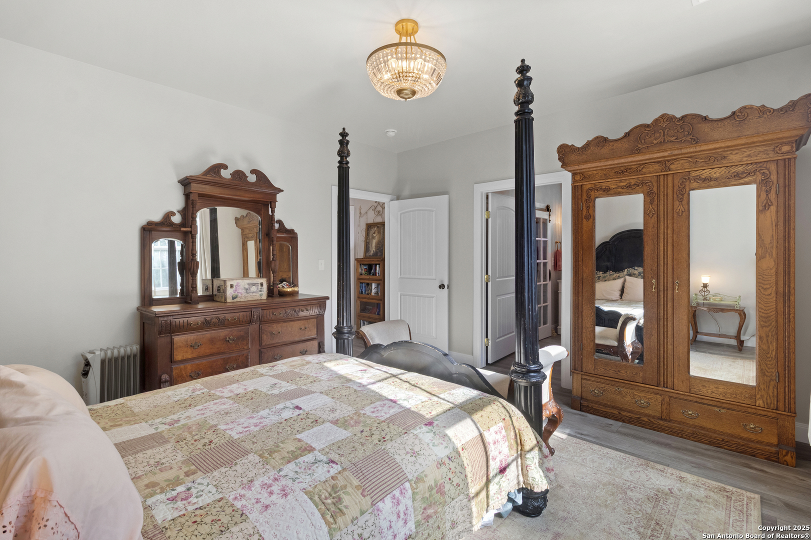 792 Alamo Beach Road Pipe Creek, TX 78063 - Photo 14 of 70 a bedroom with a bed and a dresser