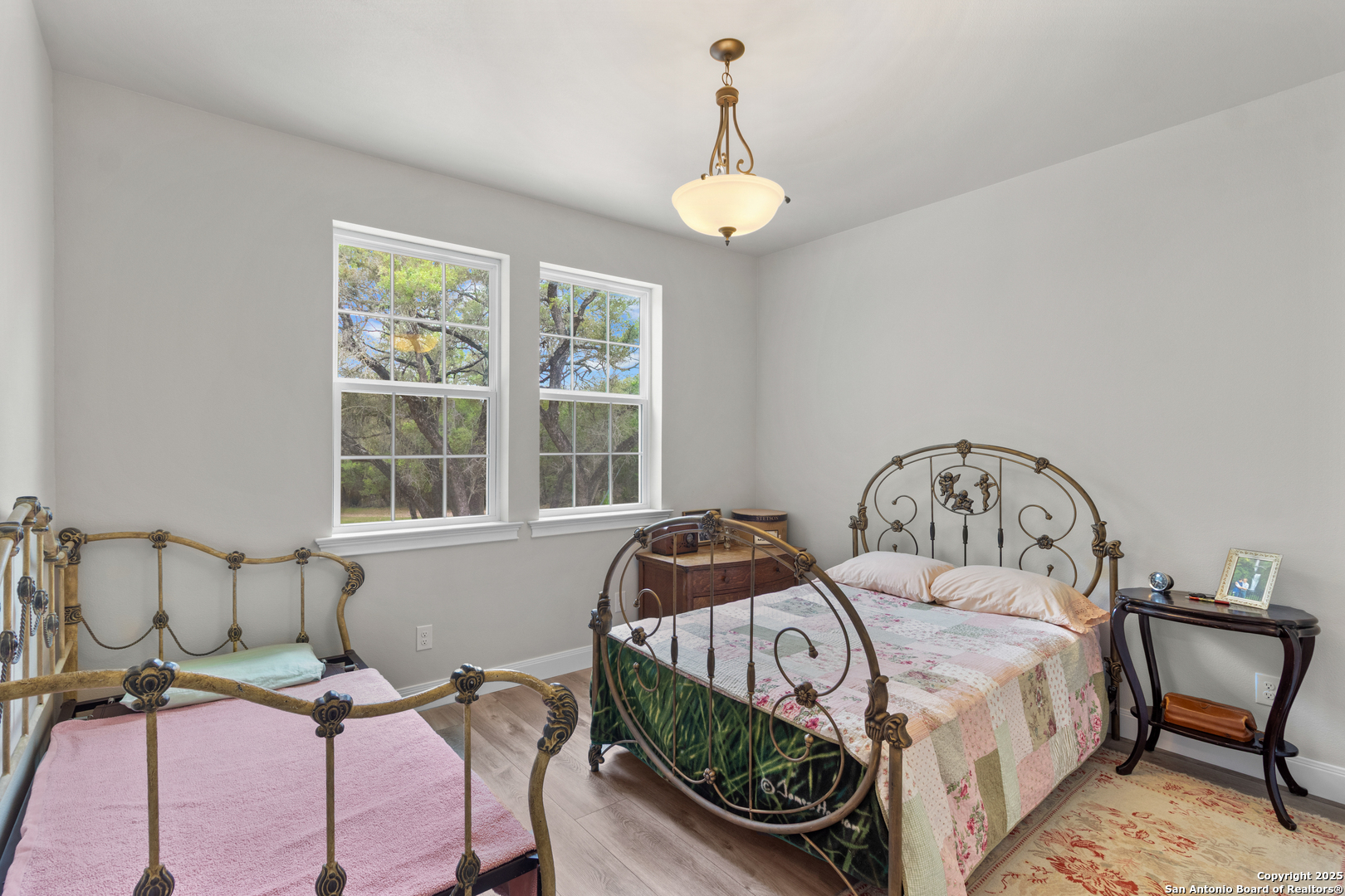 792 Alamo Beach Road Pipe Creek, TX 78063 - Photo 18 of 70 a bedroom with a bed and window