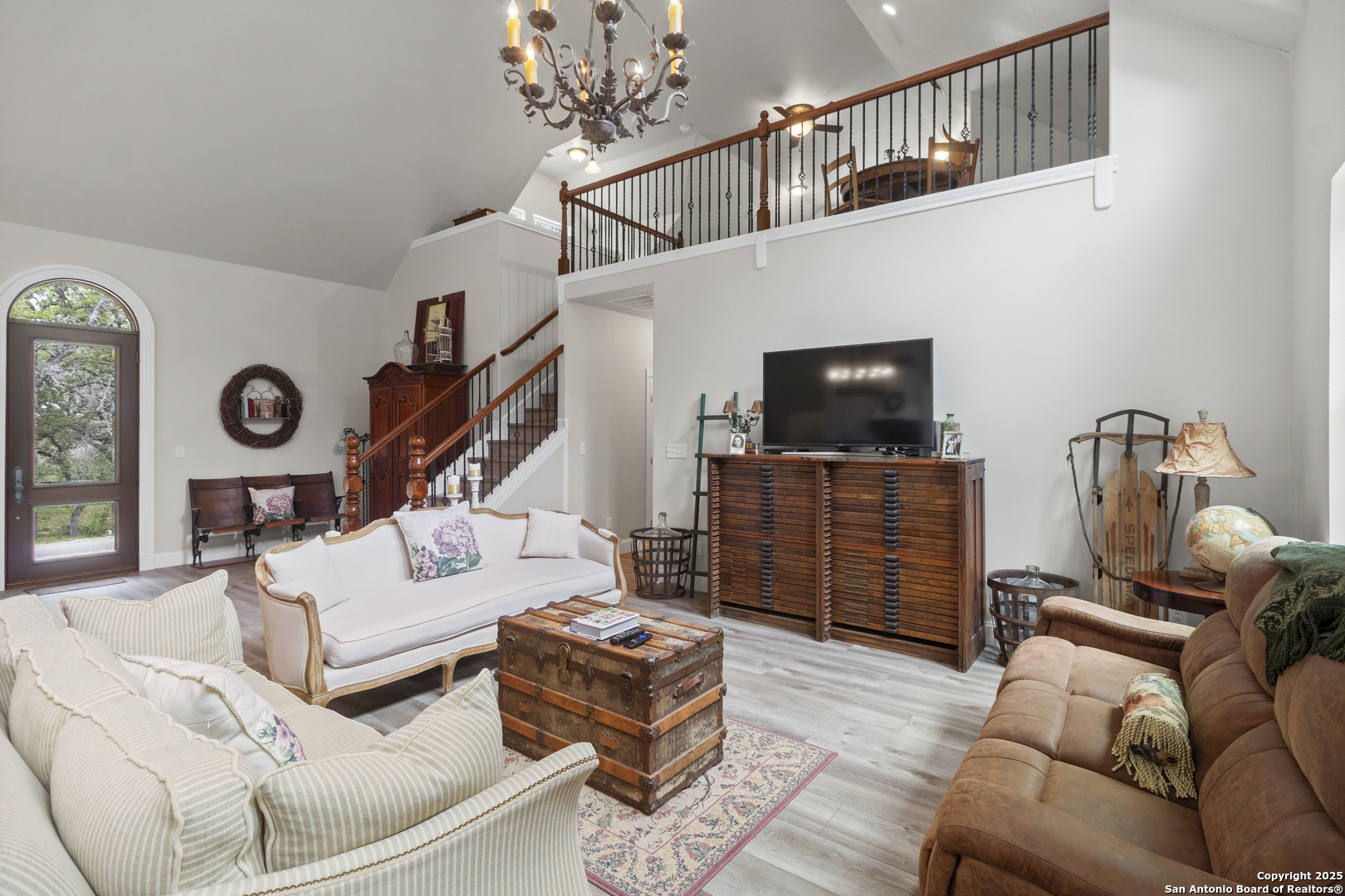 792 Alamo Beach Road Pipe Creek, TX 78063 - Photo 2 of 70 a living room with furniture a flat screen tv and a window