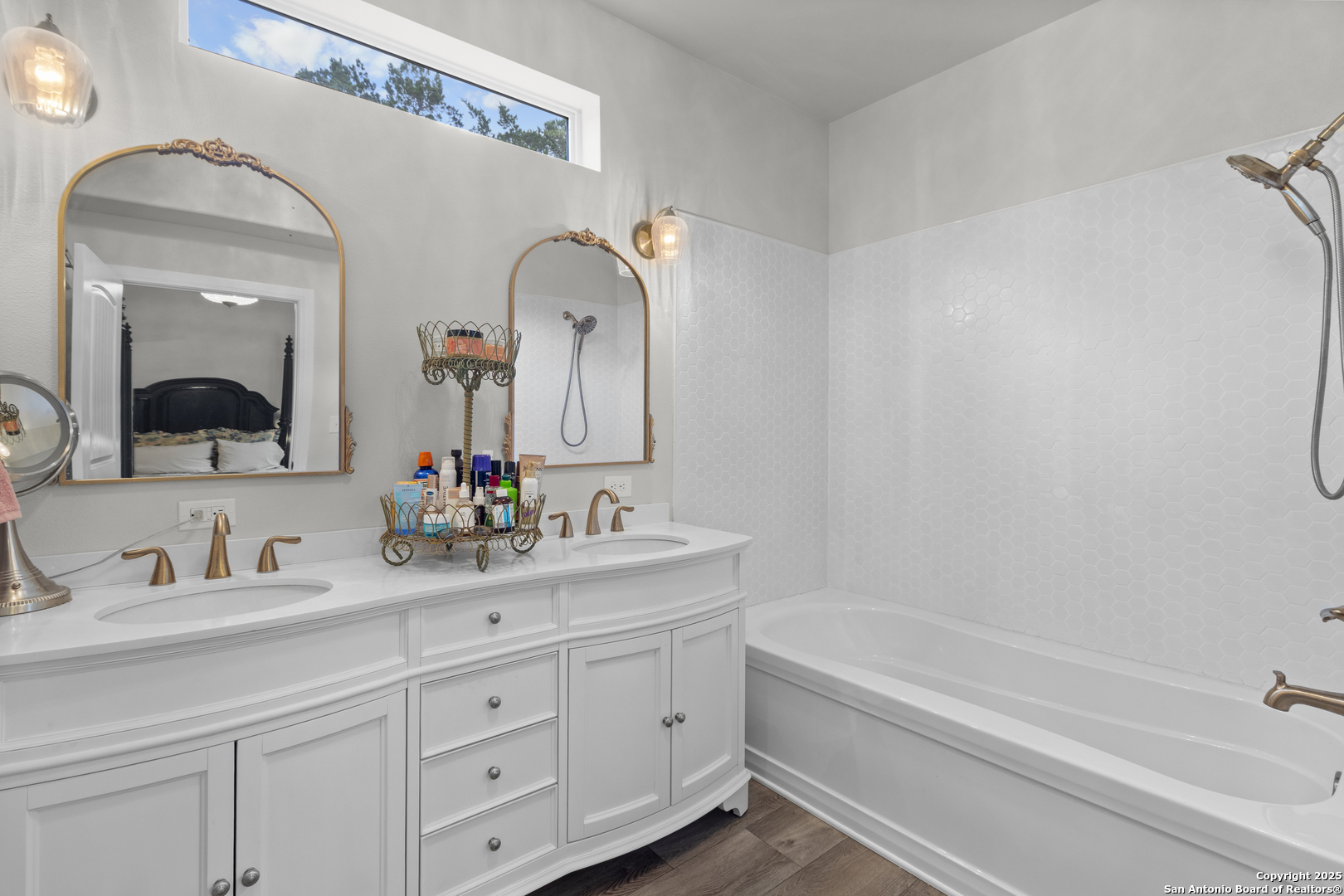 792 Alamo Beach Road Pipe Creek, TX 78063 - Photo 21 of 70 a bathroom with a double vanity sink and a mirror