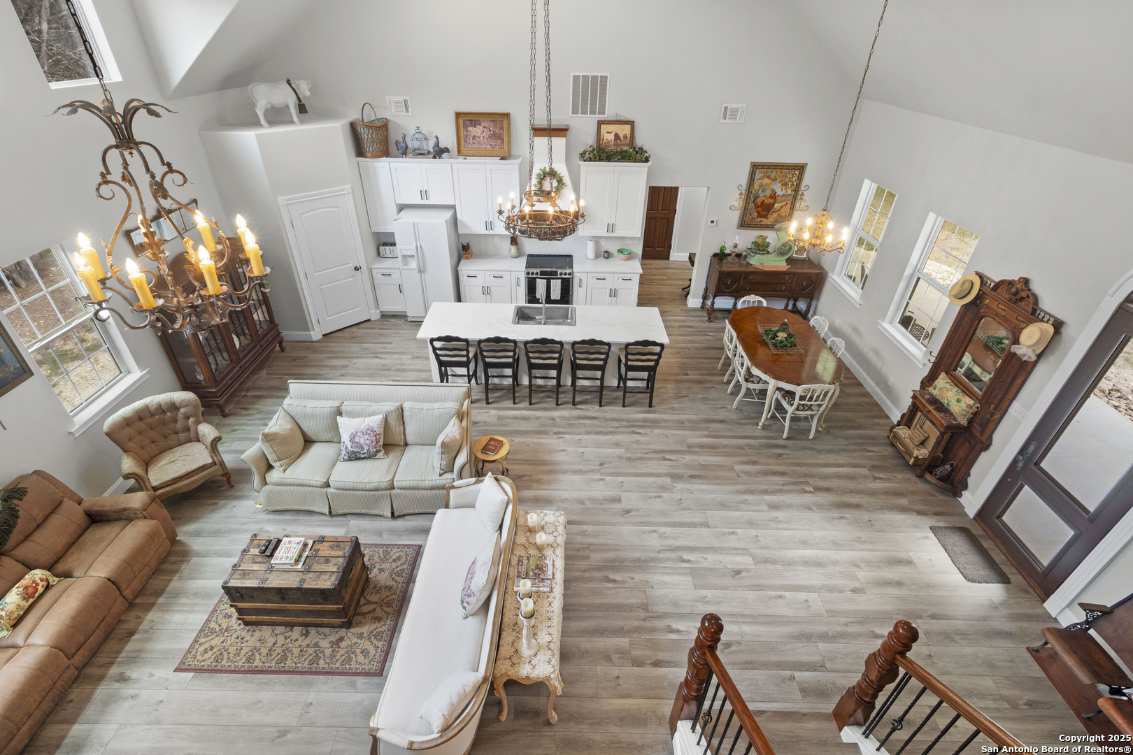 792 Alamo Beach Road Pipe Creek, TX 78063 - Photo 27 of 70 a living room with furniture and a chandelier