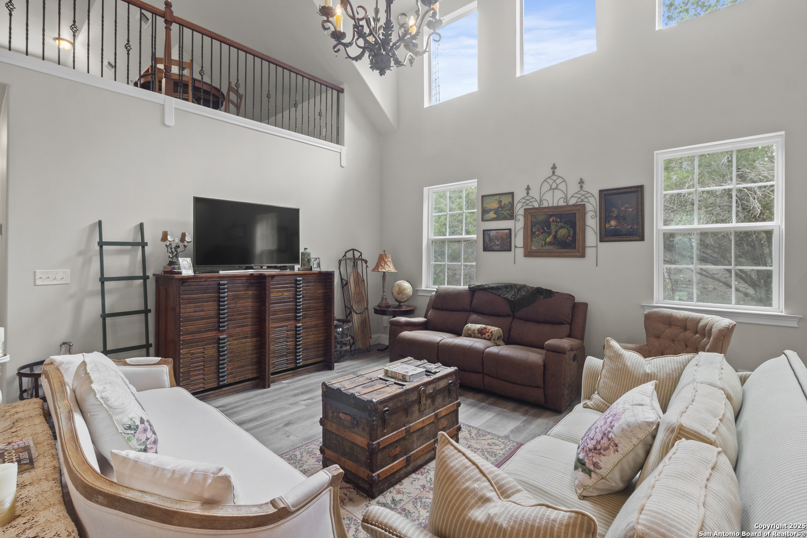 792 Alamo Beach Road Pipe Creek, TX 78063 - Photo 3 of 70 a living room with furniture a flat screen tv and a window